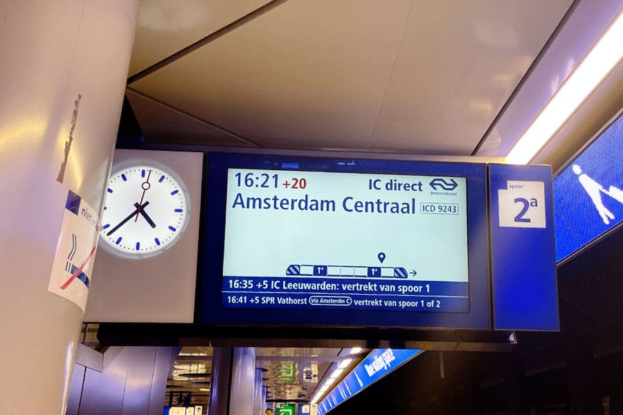 sign for amsterdam centraal on schiphol train platform